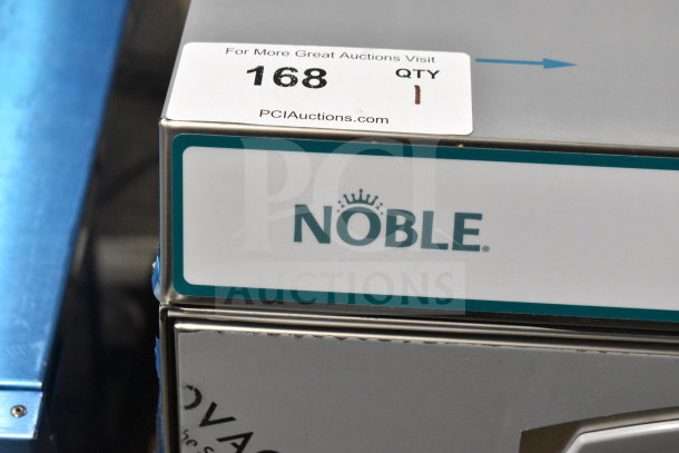Brand new Noble 495LTUC24 undercounter dishwasher with minor cosmetic damage. Low-temp model, 120V, 1 Phase, auction label visible.