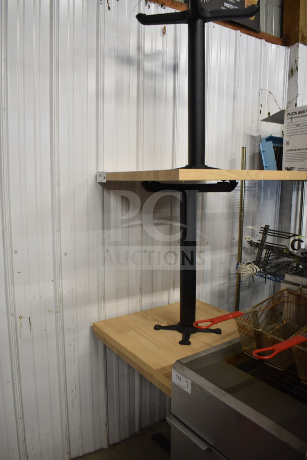12 wood pattern dining height tables with black metal base, good condition. Tags indicate quantity and auction details.