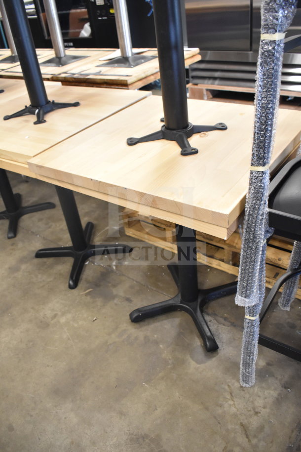 12 wood pattern dining tables with black metal bases, selling 12 times your bid, featuring sturdy construction and modern design.