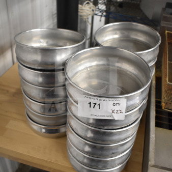 22 aluminum round baking pans stacked, good condition. Auction label reads "171, Qty 22."