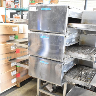 3 LIKE NEW 2025 Turbochef HhC2020 Commercial Electric Powered Conveyor Rapid Cook Oven w/ Equipment Stand on Commercial Casters. 208/240 Volts, 3 Phase. 3 Times Your Bid!