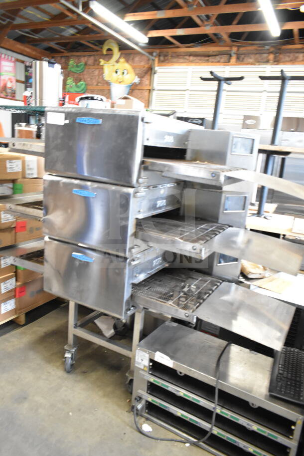Turbochef HhC2020 commercial rapid cook ovens, 3 units, on casters. Stainless steel finish, includes equipment stand.