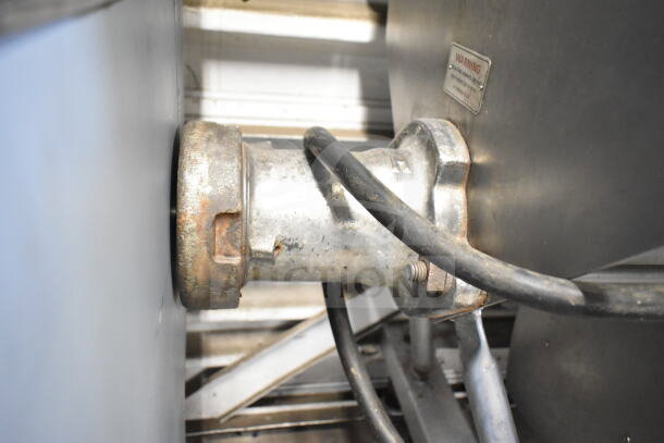 Hobart 4346 commercial meat mixer grinder, visible motor housing, on commercial casters, 200V, 3-phase, warning label shown.
