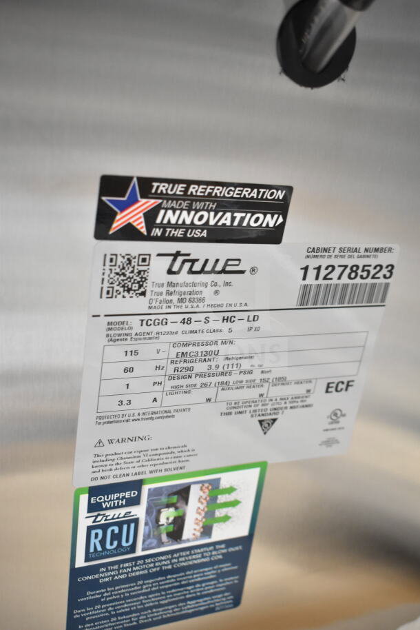 Brand new 2025 True TCGG-48-S-HC-LD deli case label showing model details, 115V, RCU Technology, and serial number 11278523.