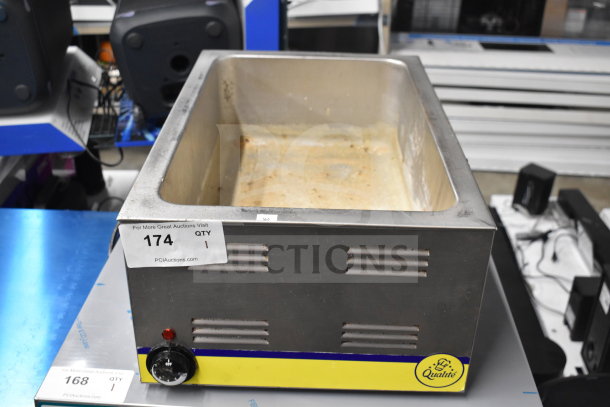 Adcraft FW-1200WF countertop food warmer, stainless steel, 120 volts, visible wear, auction tag "174" attached.