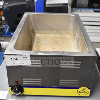 Adcraft FW-1200WF countertop food warmer, stainless steel, 120 volts, visible wear, auction tag "174" attached.