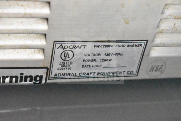 Adcraft FW-1200WF Countertop Food Warmer label, 120 Volts, 1200W, UL listed, shows slight wear. NSF certified.