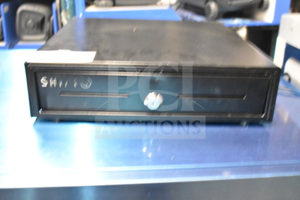 Black cash drawer with key lock and "Shift" label on front. Lightly used condition. Includes two drawers per bid.