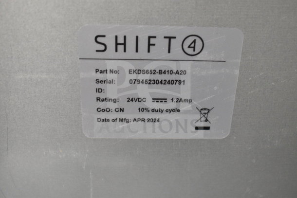 Shift4 cash drawer label showing part number EKDS652-B410-A20, serial 079452304240791, 24VDC, 1.2Amp, made April 2024.