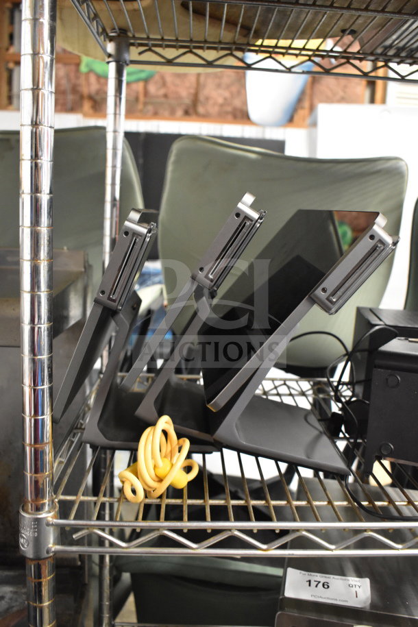 Three POS monitors including Pax L1400, in good condition, on a metal shelf with power cords.