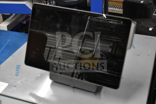 Three POS monitors, including Pax L1400 model, in good condition; ideal for business applications.