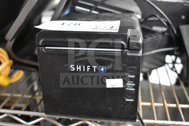 7 receipt printers including SNBC BTP-S80 and Epson M374C, in used condition. Visible Shift 4 branding, numbered labels present.