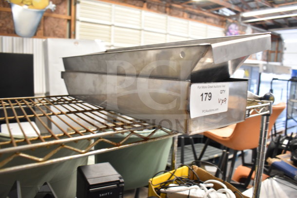 Stainless steel bins on a wire shelf, labeled "179 QTY X9" for auction. Includes wooden paddles, leg, gas regulator.