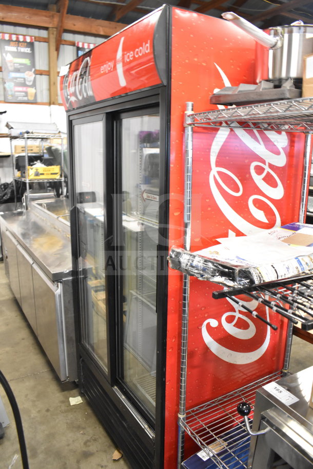 True GDM-33 Commercial 2 Door Cooler Merchandiser with Coca-Cola branding, glass doors, 115V, 1 phase; used condition.