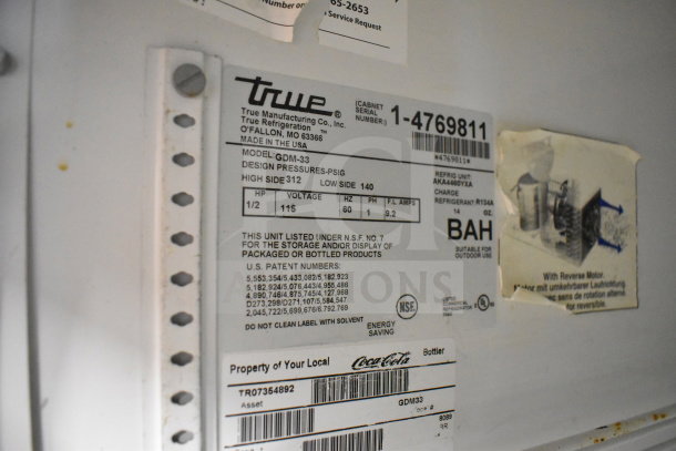 True GDM-33 Commercial Cooler label showing model, serial number, voltage, refrigeration details, suitable for outdoor use.