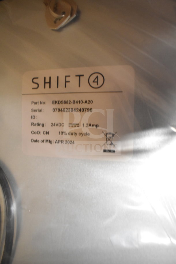 Shift4 2024 cash drawer label. Part No: EKD9652-B410-A20. 24VDC, 1.2Amp. Made April 2024. New condition with minor cosmetic flaws.