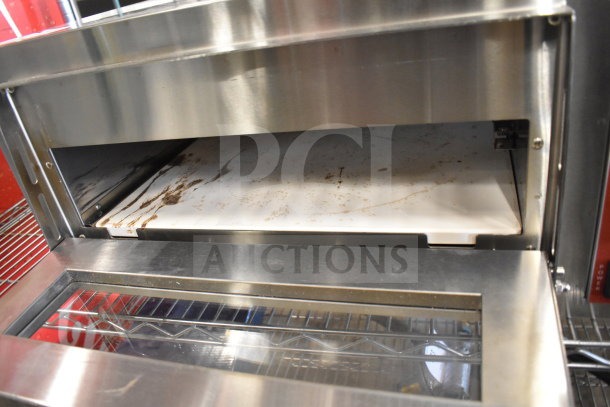 Brand new Avantco 177DPO18S countertop pizza oven, single deck, 120V, minor scratches and dents visible, commercial use.