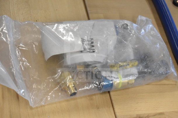 Brand new Dormont 1650KIT48 gas connector kit in plastic bag, includes 48" SnapFast® connector, two elbows, restraining cable.