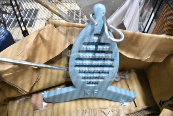 Box containing scratched and dented metal tool with hooks, labeled "KF," part of a lot including a Yeler Plastic Film Sealer.