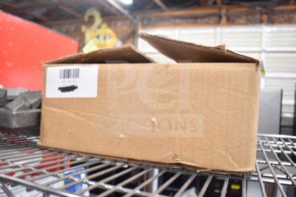 Box labeled "HP1181100" with scratch and dent items including Vigor SS1 7.6 Qt. pan, range grate, and glass jars.