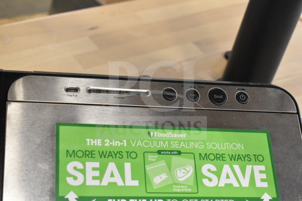 Brand new FoodSaver V4840 vacuum sealer, 120V, 1 phase, scratch and dent model. Features buttons for seal and food settings.