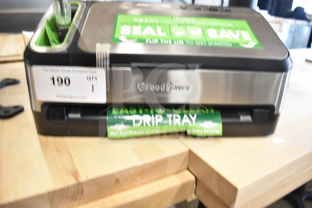 Brand new FoodSaver V4840 vacuum sealer, 120V, 1 phase; features easy-clean drip tray, minor scratches and dents visible.