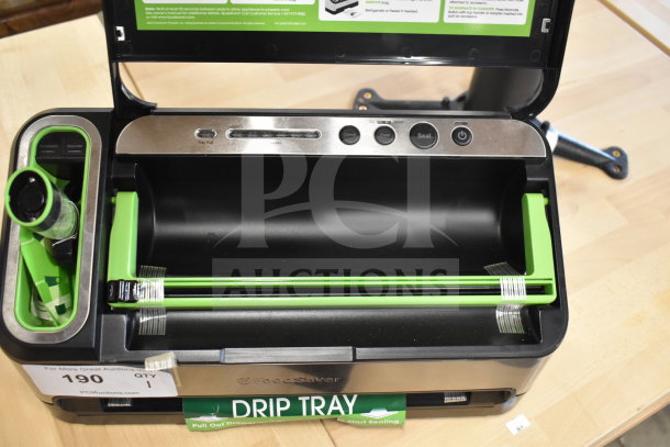 Brand new FoodSaver V4840 vacuum sealer, 120V, 1 Phase. Features open lid, drip tray, and control buttons. Scratch and dent item.