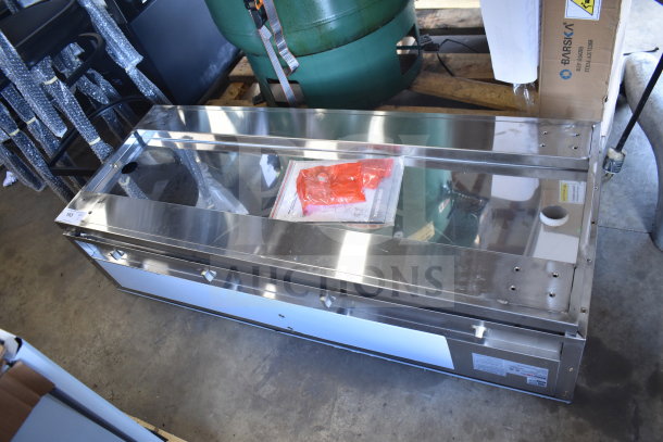 Brand new ServIt 423EST4WSPBH four-pan electric steam table, 208/240 volts, partially enclosed base, minor dents.