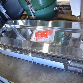 Brand new ServIt 423EST4WSPBH four-pan electric steam table, 208/240 volts, partially enclosed base, minor dents.
