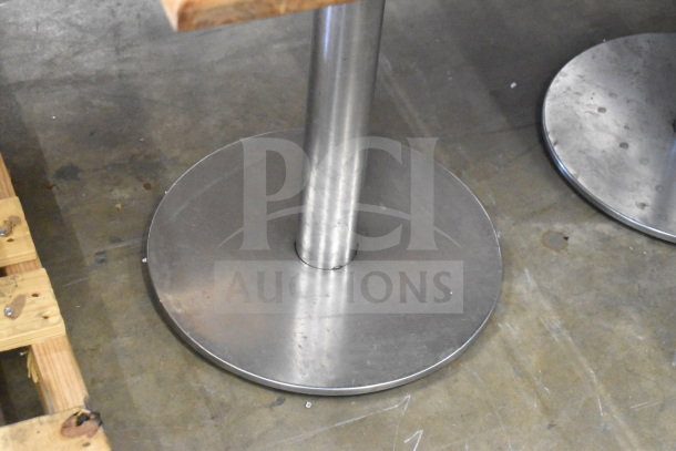 Wooden dining height table with a sturdy metal base, shown top view. New condition. Auction offers 10 times quantity.