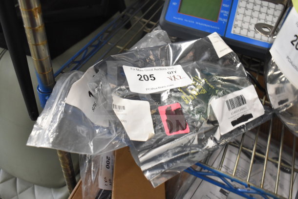 Brand new Vulcan latch and Pitco driver board in packaging, labeled with auction tag 205, indicating quantity two.