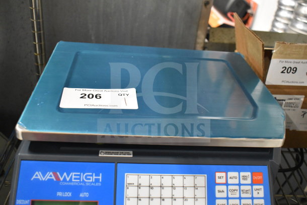 Brand new AvaWeigh 334PCSP60 thermal label printing scale, slight scratches, visible control panel and auction tag.