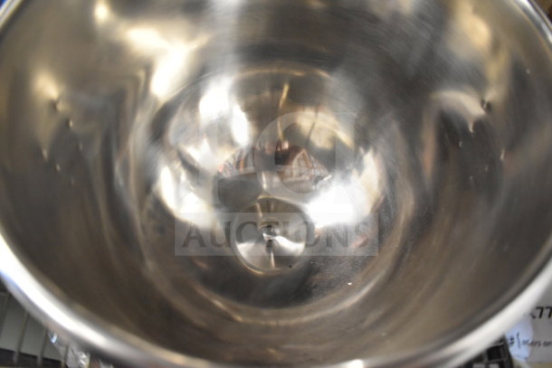 Brand new Vollrath 40761 stainless steel mixing bowl for 40756 10 Qt. mixer, with slight dents visible.