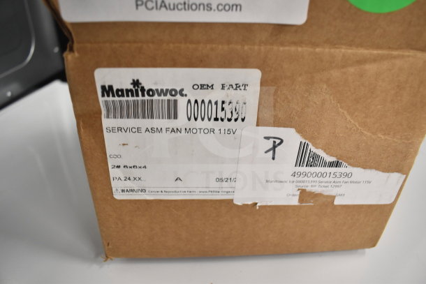 New Manitowoc Ice 000015390 Service Asm Fan Motor 115V box with visible label and barcode in original packaging.