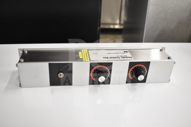 "Brand new Hatco RMB-14V remote control box, silver with dual dials, slight scratches. Label indicates model and specs."