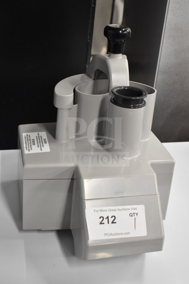 Gray Poly Continuous Feed Head for food processor, brand new with scratches and dents, functional design, label "212" visible.