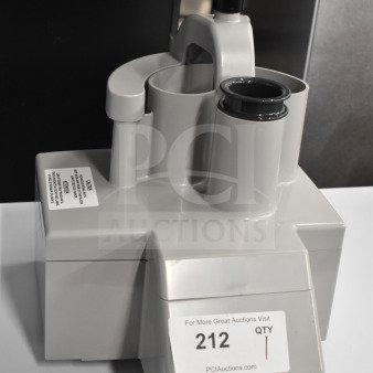 Gray Poly Continuous Feed Head for food processor, brand new with scratches and dents, functional design, label "212" visible.