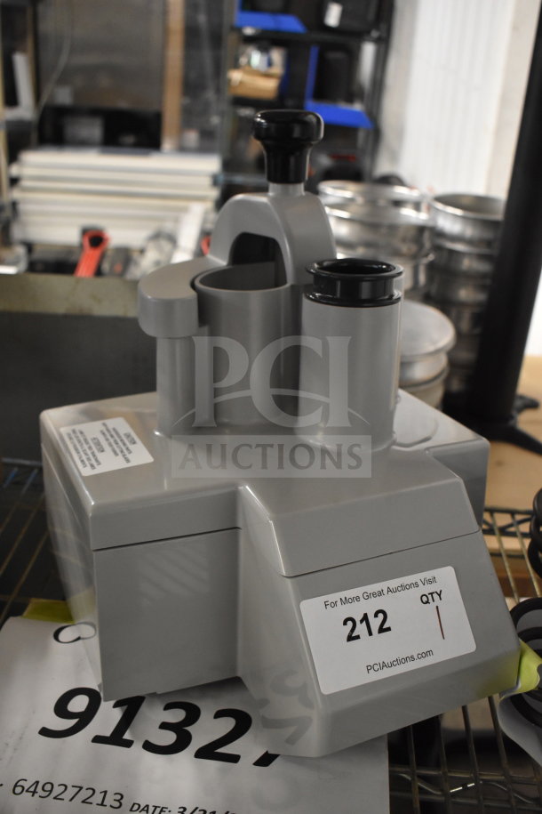 Gray poly continuous feed head for food processor, brand new with minor scratches. Labels indicate auction lot 212.