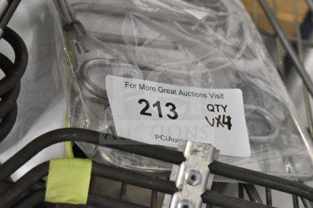 Gray poly food processor feed head, new condition, scratch and dent labeled. Auction tag "213 QTY 4."