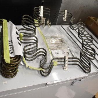 4 brand new heating elements including Hatco X02.08.675.00, Garland 4518356, and Pitco 50006605, tagged for auction.