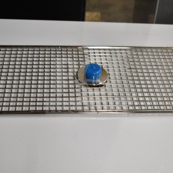 Brand new Pitco® B6664303 filter support with minor dents, metal grid design, blue center knob, ideal for filtration support.