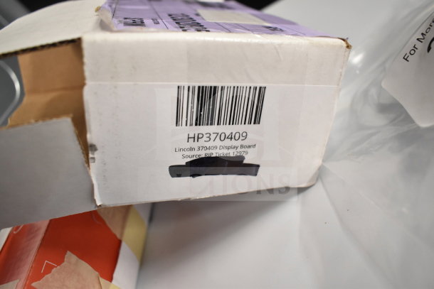 Box with label showing Lincoln 370409 Display Board. Text includes model HP370409 and source RIP Ticket 12979.