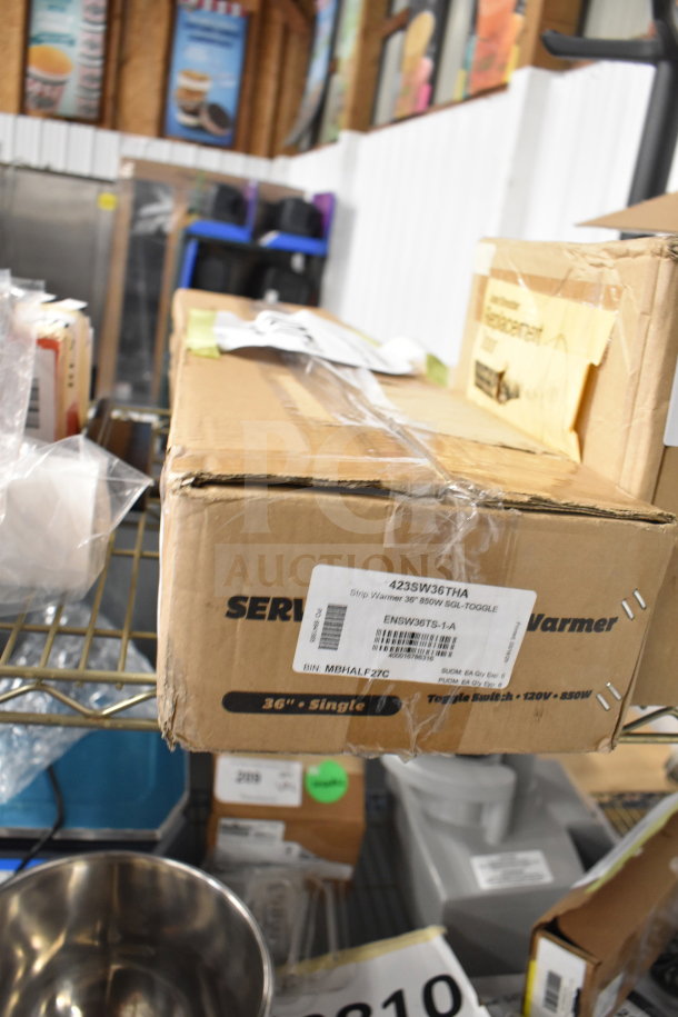 Brand new ServIt 36" Strip Warmer in box, model 423SW36THA, 850W, 120V, with single toggle control. Box shows minor scratches.