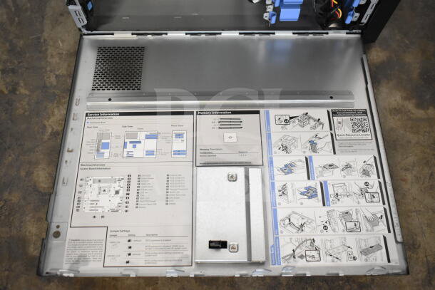 Dell PowerEdge T130 computer tower interior showing service information, diagrams, and component layout guide.