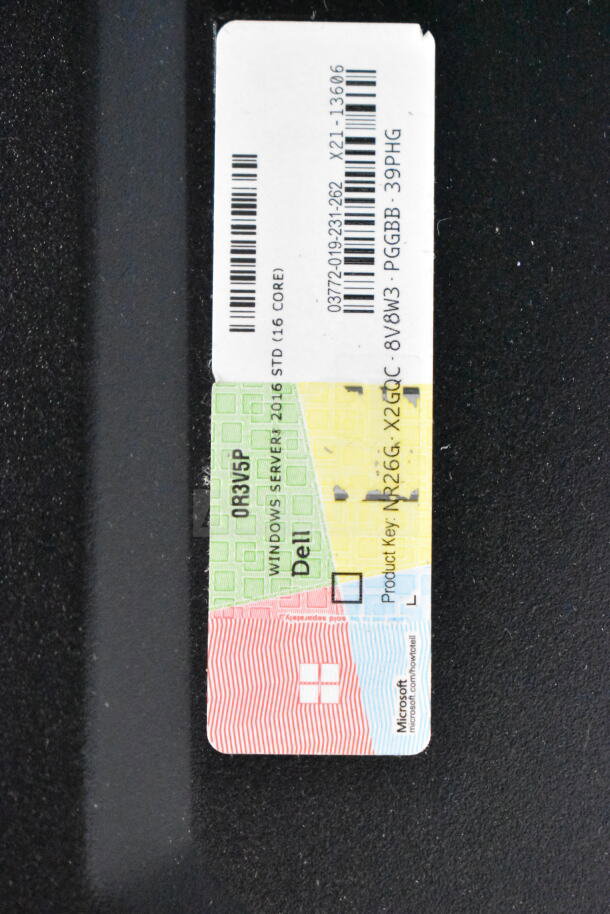 Close-up of a product key label on the Dell PowerEdge T130 computer tower, displaying Windows Server 2016 Standard (16 Core).