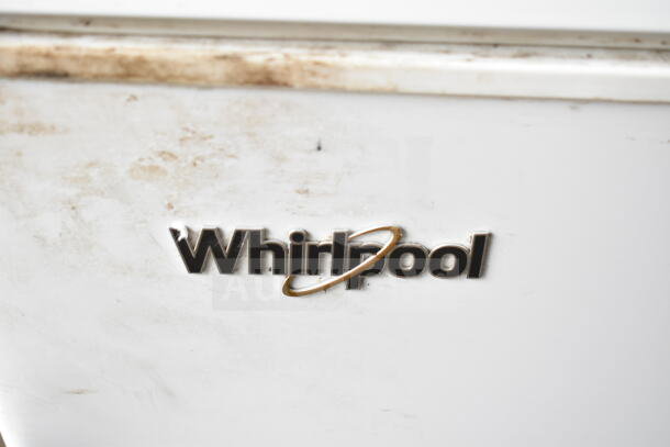 Whirlpool WZC5116LW chest freezer with visible brand logo. Used condition, white surface shows some wear. 115 Volts, 1 Phase.