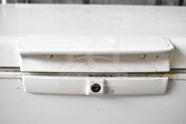 Whirlpool WZC5116LW chest freezer lid and lock, showing wear and minor scratches. 115V, 1 Phase, functional condition.