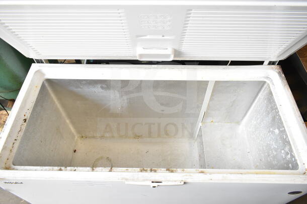 Whirlpool WZC5116LW chest freezer, open lid, white interior, visible wear and marks, 115 volts, 1 phase, model WZC5116LW.