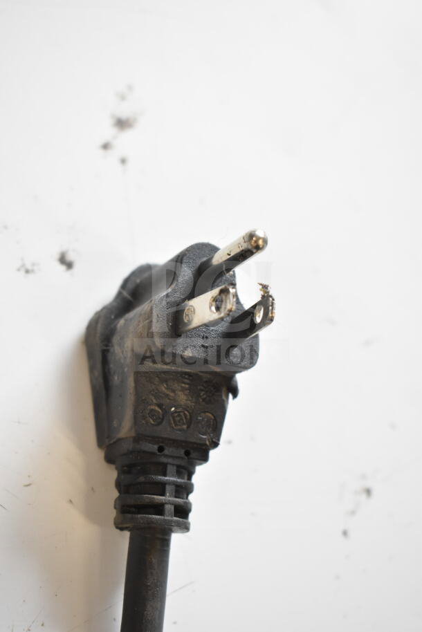 Close-up of a worn power plug for a Whirlpool WZC5116LW chest freezer, 115 volts, 1 phase.