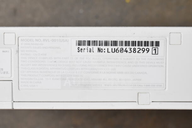 Nintendo Wii Model No. RVL-001(USA) with serial number LU60438299, for auction. Includes controllers, games.